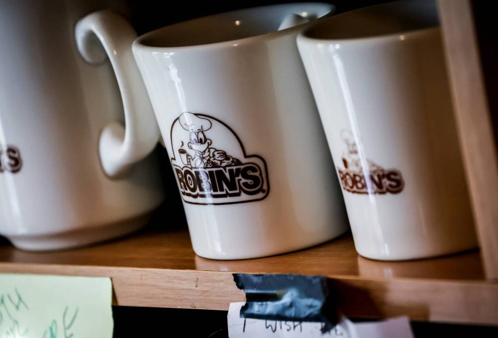 JOHN WOODS / FREE PRESS
On a near-weekly basis, Moore searches the internet for Robin's Donuts merchandise.