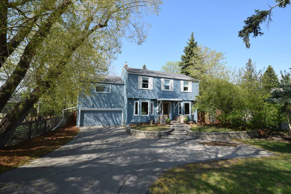 TODD LEWYS PHOTOS / FREE PRESS
259 Churchill Dr. is situated on a mature, extra-deep lot across from the river in gorgeous Riverview.