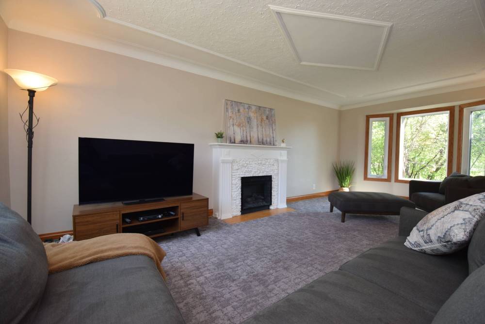 The stately electric fireplace is the focal point of the living room.