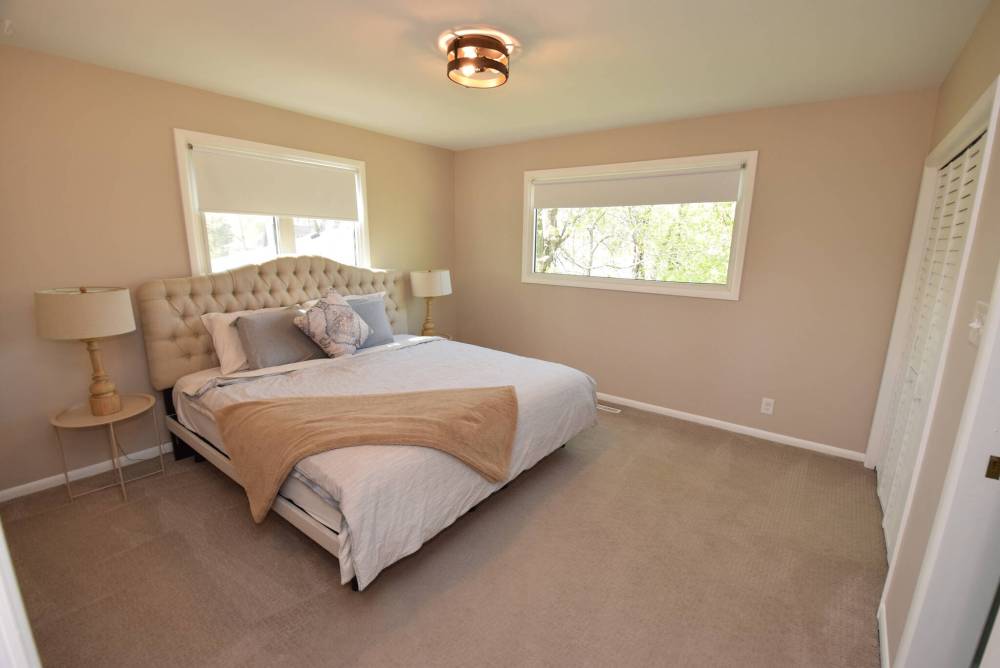 With its treetop views, the primary bedroom is a pleasingly calm and private space.