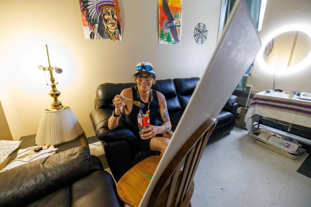 MIKE DEAL / FREE PRESS
Lawrence, in his suite, where he does a lot of painting, lost everything during COVID and ended up homeless. He’s since been housed by the province through Your Way Home.