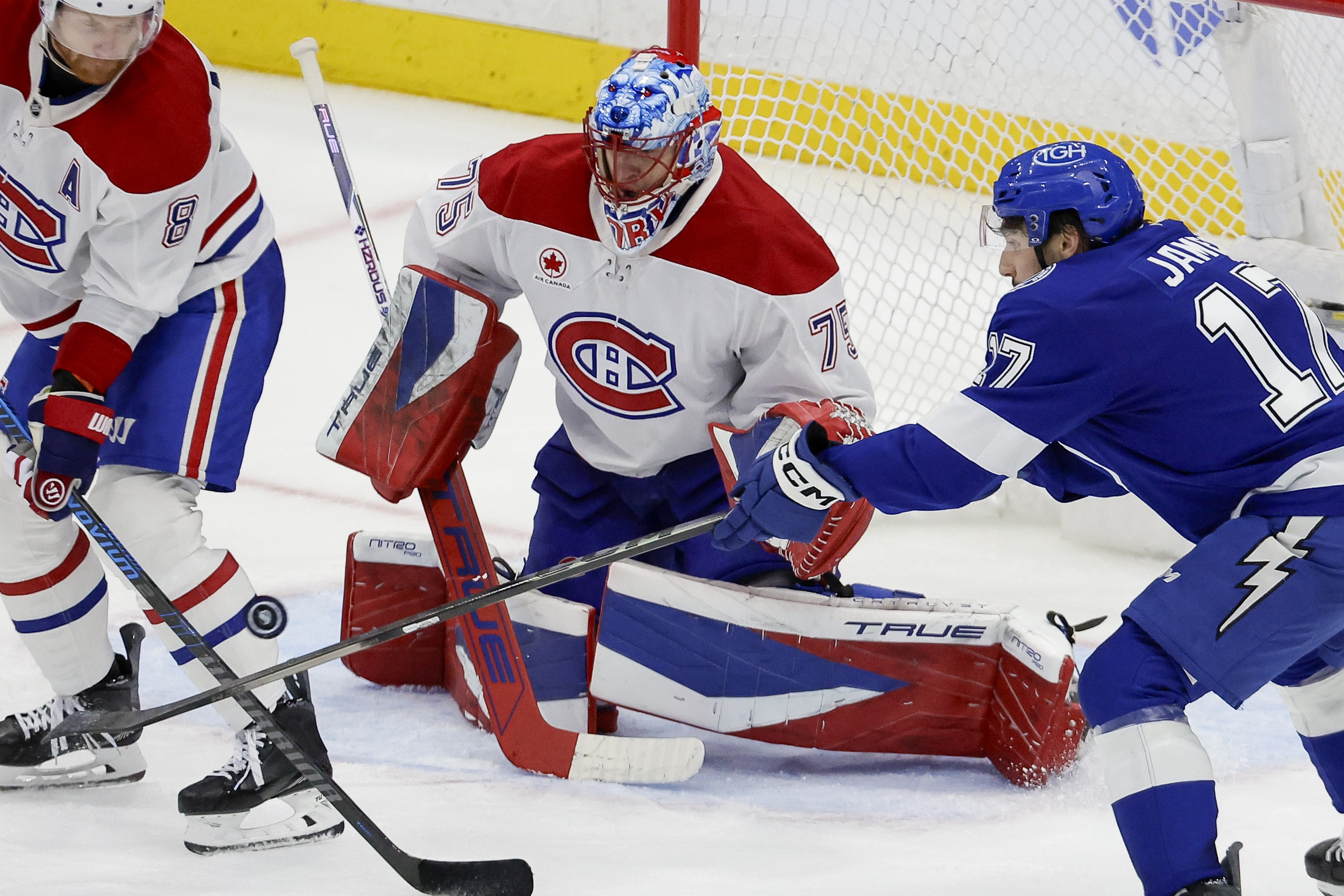 Tampa Bay Lightning centre Dominic James tips in a shot for a goal against Montreal Canadiens goaltender Jakub Dobes