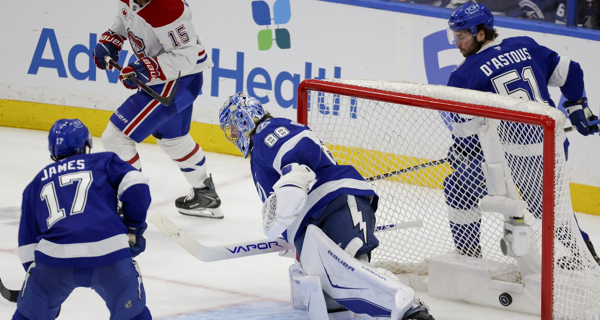 The puck of Montreal Canadiens centre Alex Newhook gets past Tampa Bay Lightning goaltender Andrei Vasilevskiy
