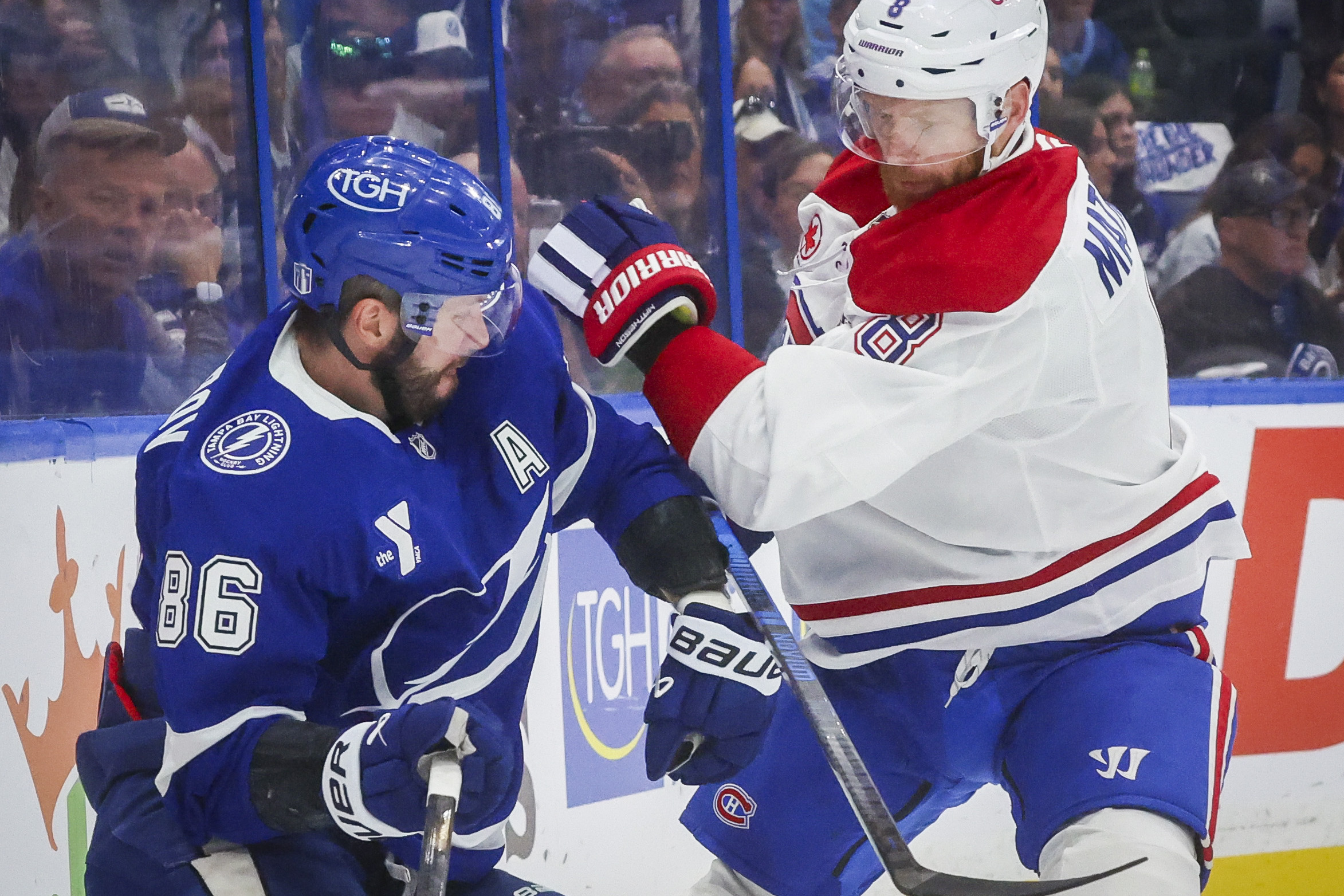 Tampa Bay Lightning right wing Nikita Kucherov and Montreal Canadiens defenceman Mike Matheson collide 