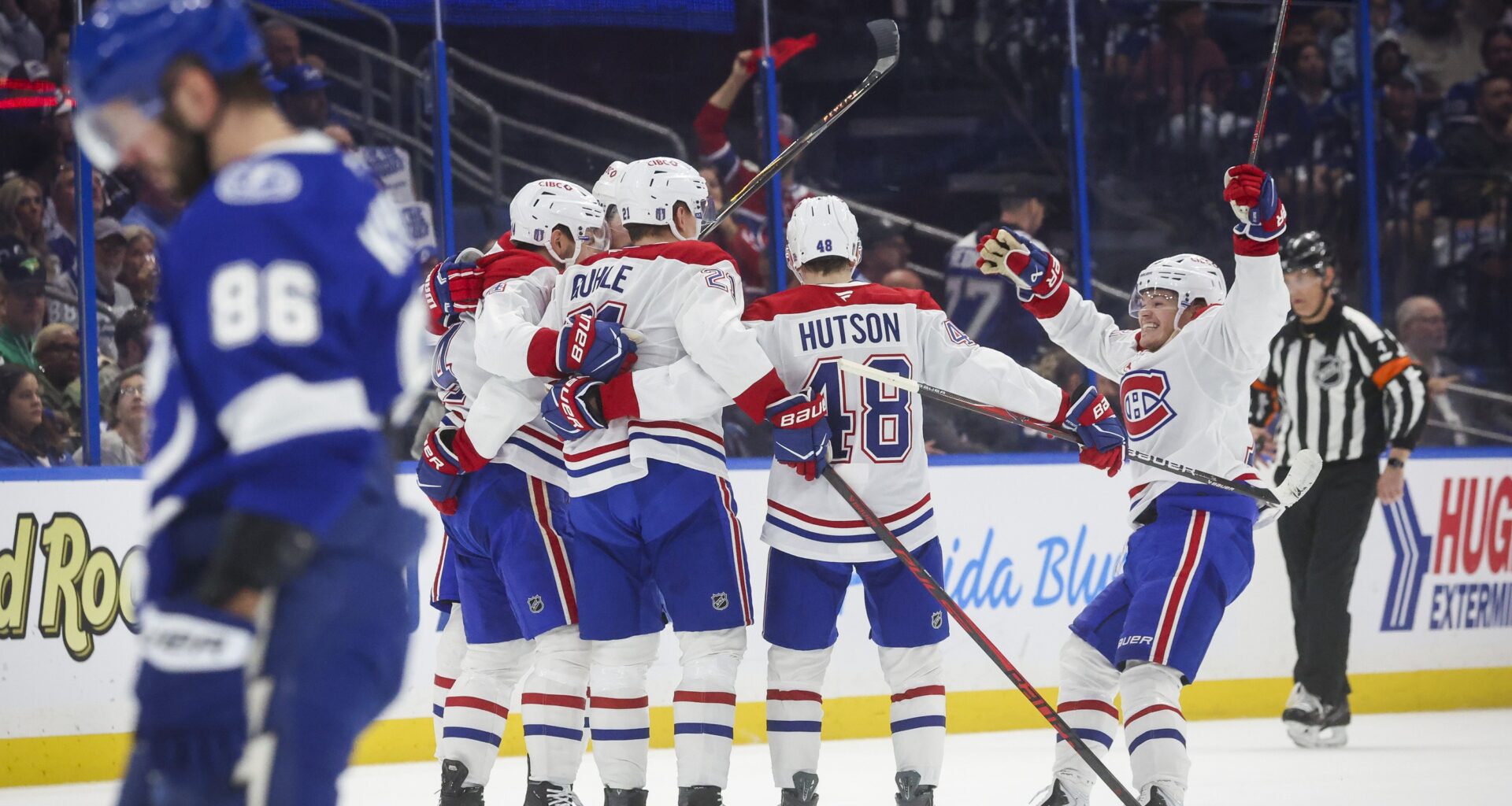 Montreal Canadiens teammates celebrate a first period goal by centre Nick Suzuki