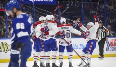 Montreal Canadiens teammates celebrate a first period goal by centre Nick Suzuki