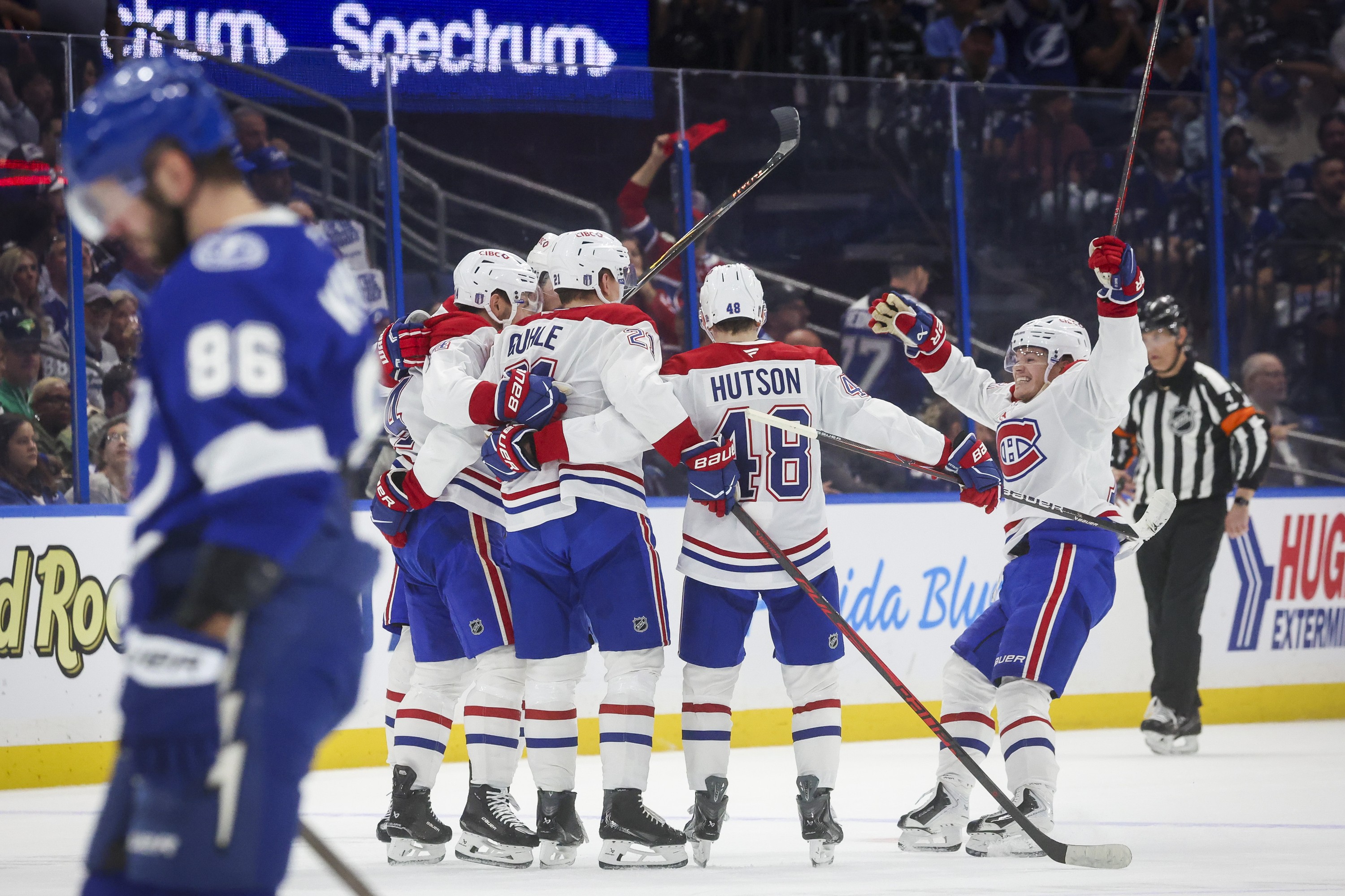 Montreal Canadiens teammates celebrate a first period goal by centre Nick Suzuki
