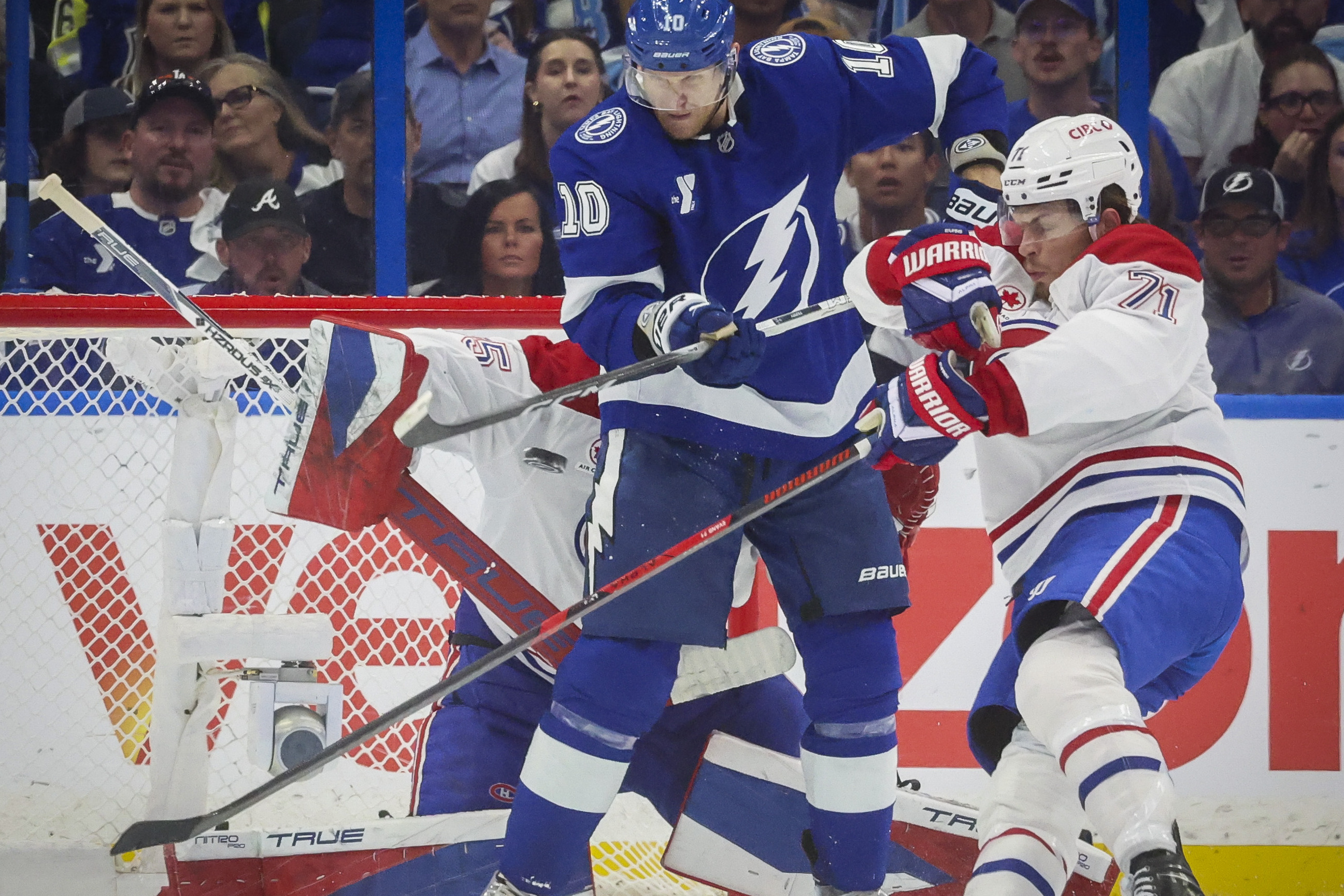 Tampa Bay Lightning right wing Corey Perry and Montreal Canadiens centre Jake Evans tangle