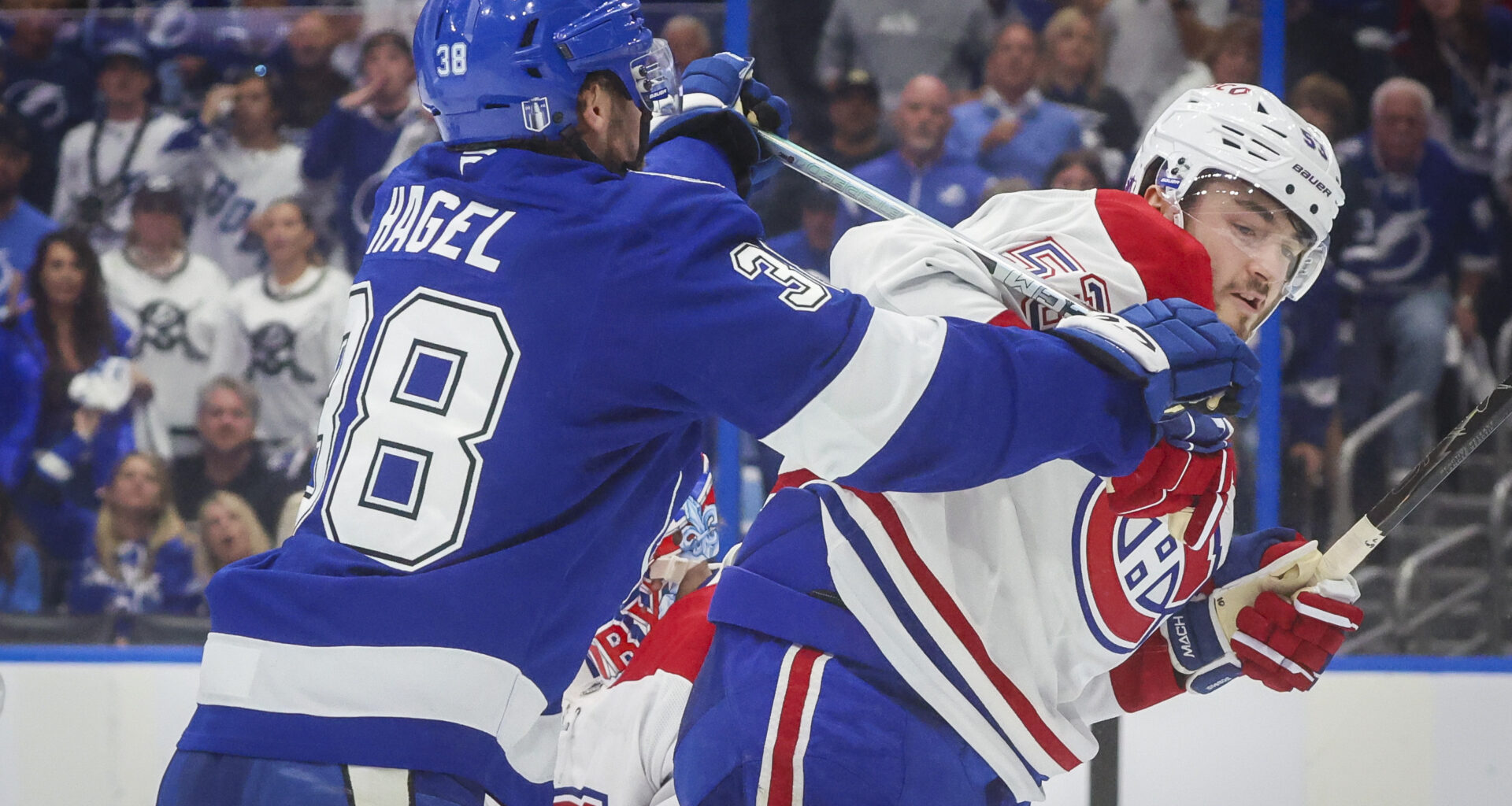 Tampa Bay Lightning left wing Brandon Hagel pushes Montreal Canadiens defenceman Noah Dobson