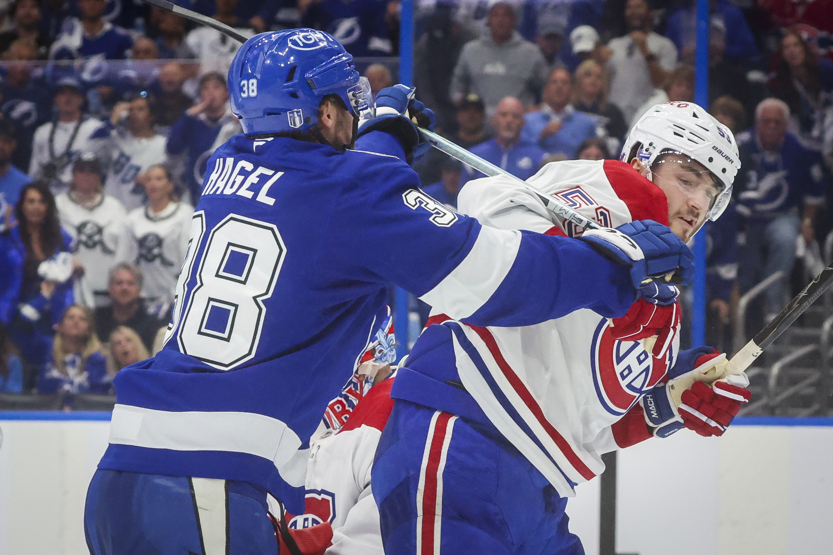 Tampa Bay Lightning left wing Brandon Hagel pushes Montreal Canadiens defenceman Noah Dobson