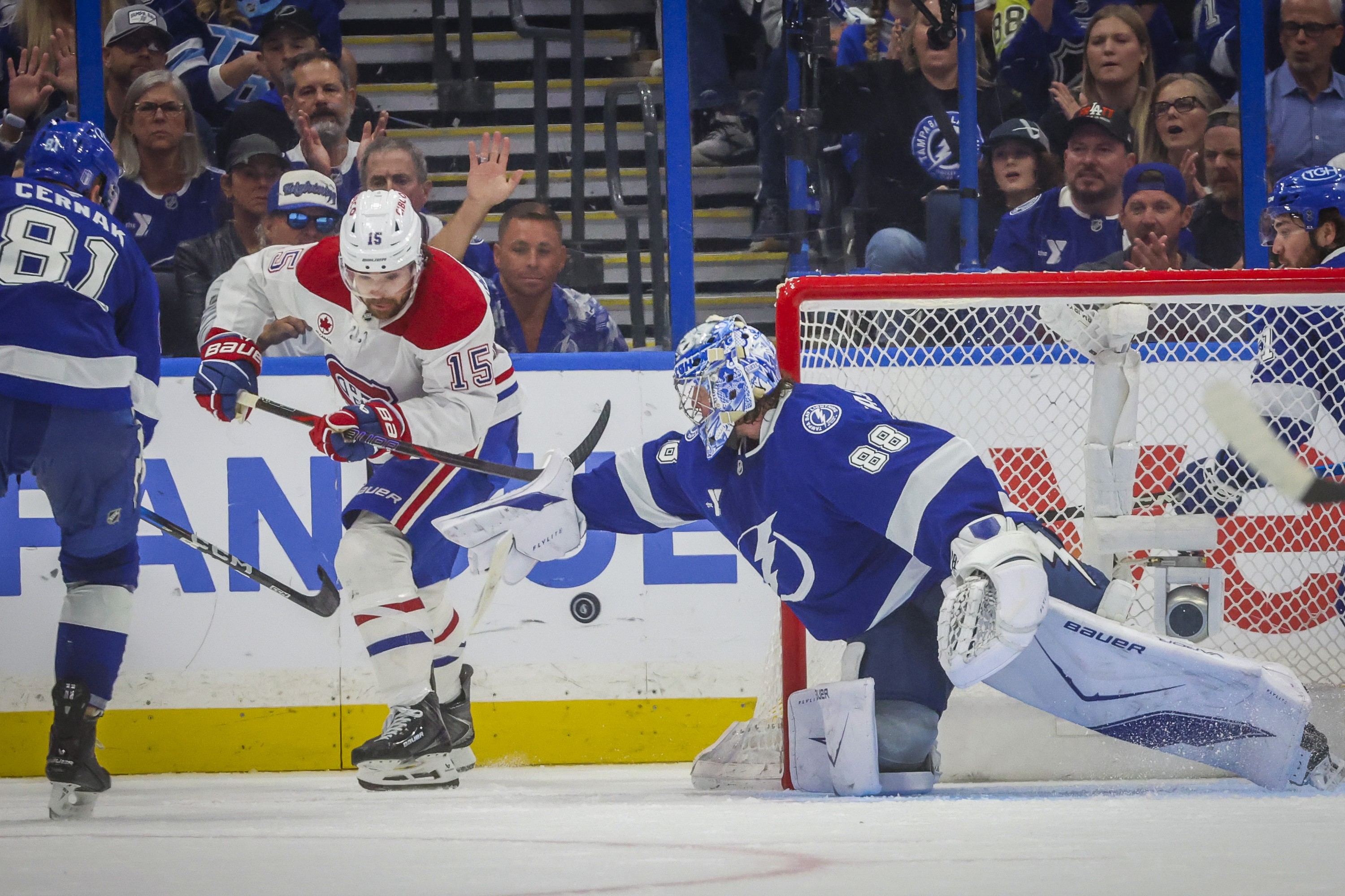 Tampa Bay Lightning goaltender Andrei Vasilevskiy attempts to knock the loose puck as Montreal Canadiens centre Alex Newhook is able to slip the puck past Vasilevskiy for a goal