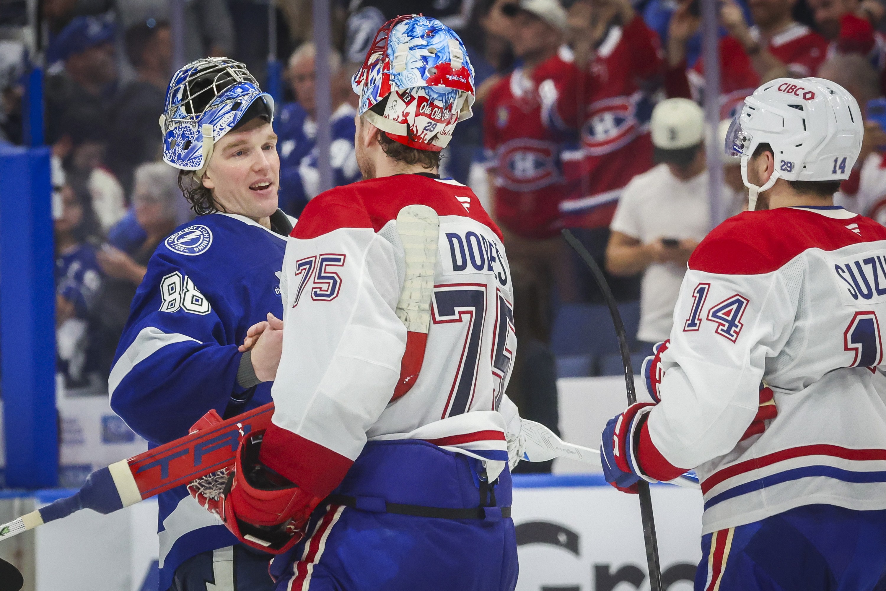 Tampa Bay Lightning goaltender Andrei Vasilevskiy congratulates Montreal Canadiens goaltender Jakub Dobes