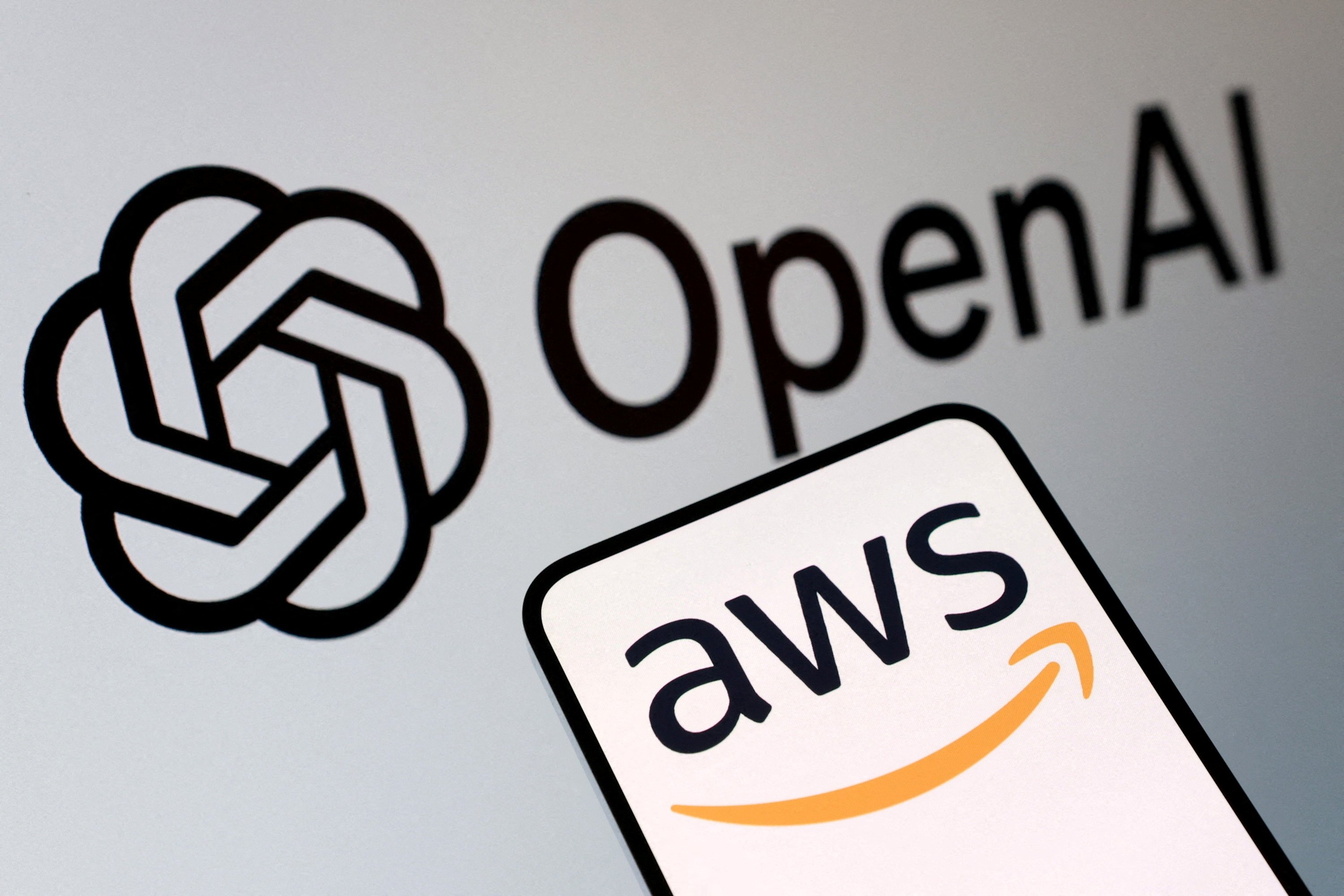 This illustration shows OpenAI and AWS logos, Nov. 3, 2025. (Reuters Photo)