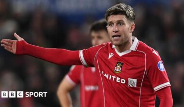 Josh Windass holds out his arm