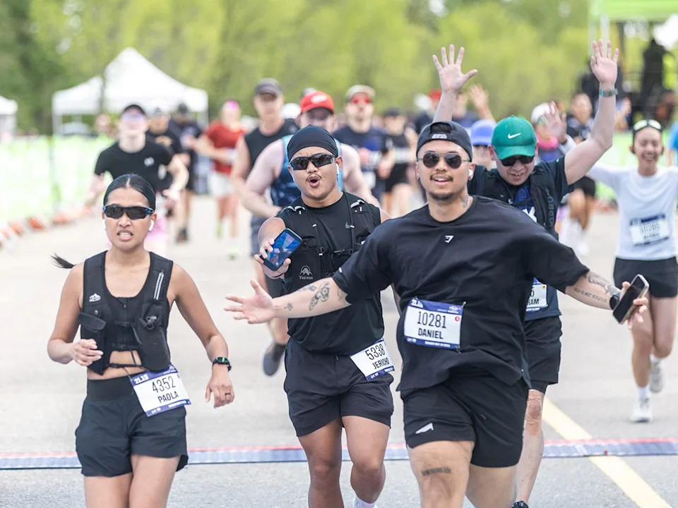 Runners cross the finish line in the 21.1 km event of the Servus Calgary Marathon on Sunday, May 24, 2026.