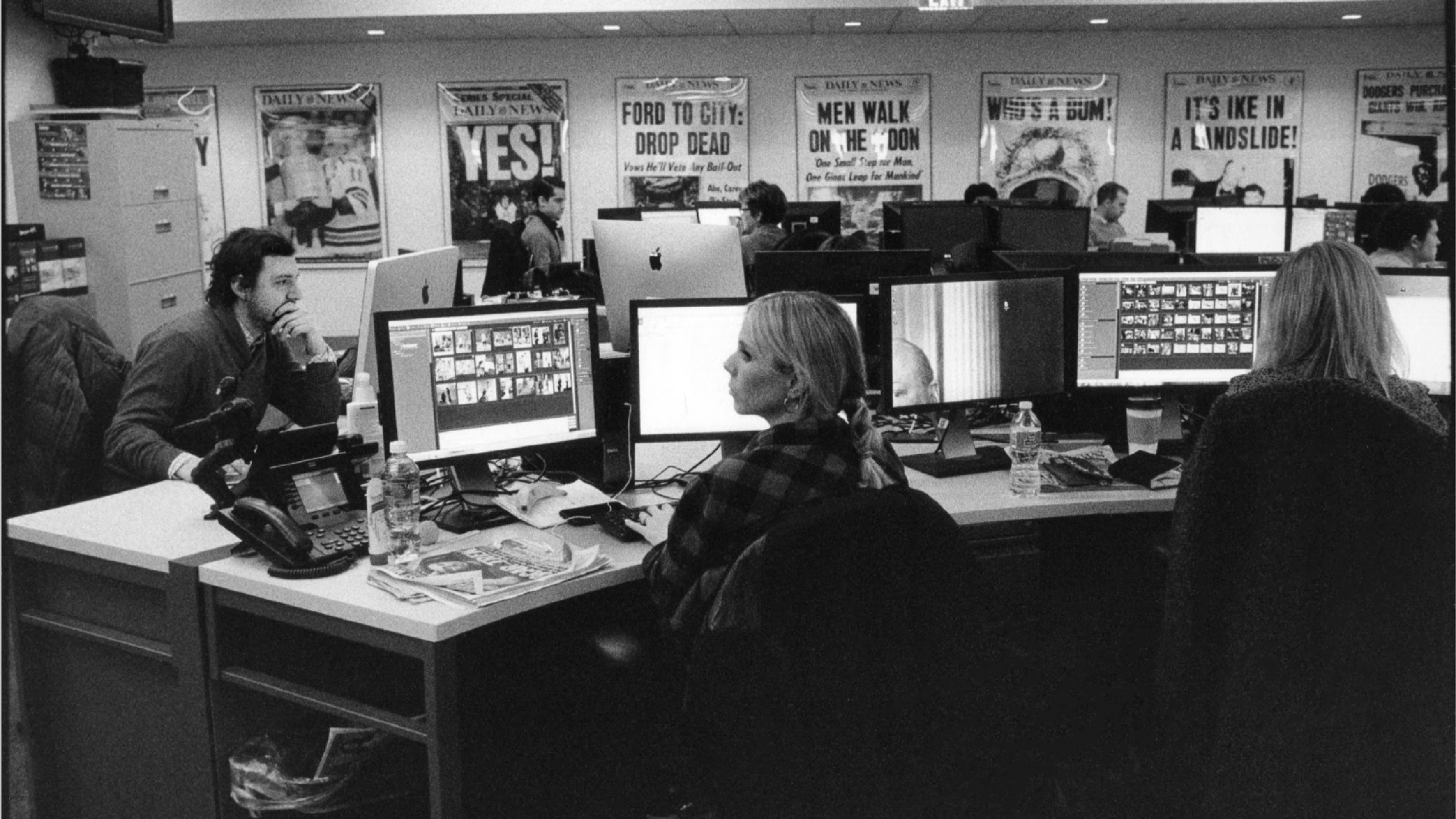 Office workers at their desks.