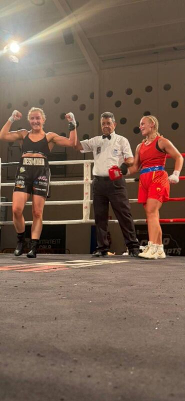 Cork’s own Christina Desmond gets her hand raised by the referee after she stopped English girl Sherie Barnes to go 5-0 in Alicante in Spain last Saturday night.