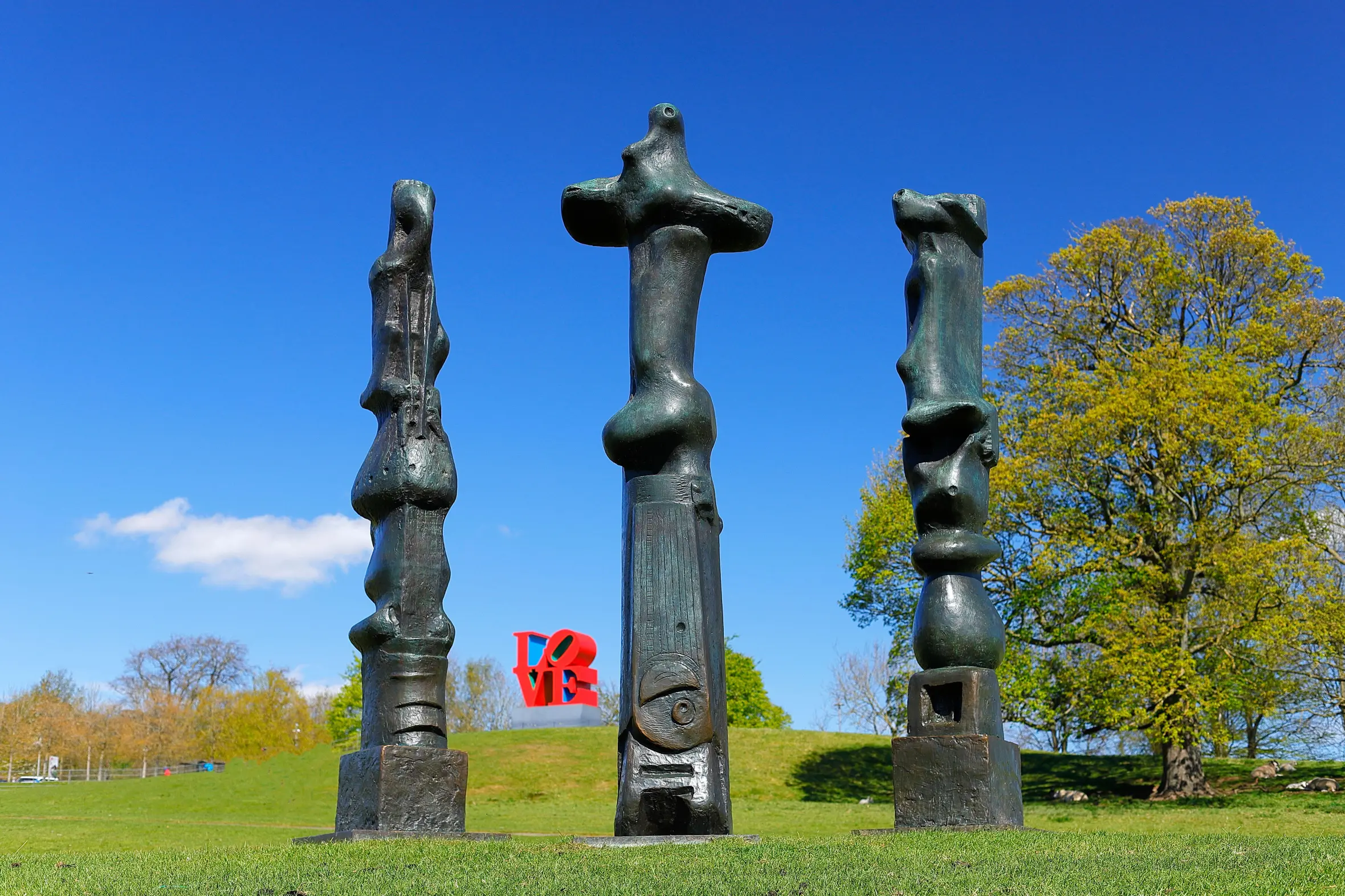 Upright Motives Nos. 1, 2, and 7, by Henry Moore, on display at Yorkshire Sculpture Park.