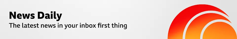A thin, grey banner promoting the News Daily newsletter. On the right, there is a graphic of an orange sphere with two concentric crescent shapes around it in a red-orange gradient, like a sound wave. The banner reads: "The latest news in your inbox first thing.”