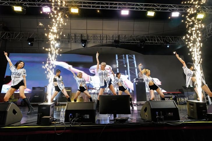 K-pop singer Jeon Somi, fourth from left, performs onstage during a Seoul National University festival in Seoul in September 2025. Captured from Seoul National University's Instagram