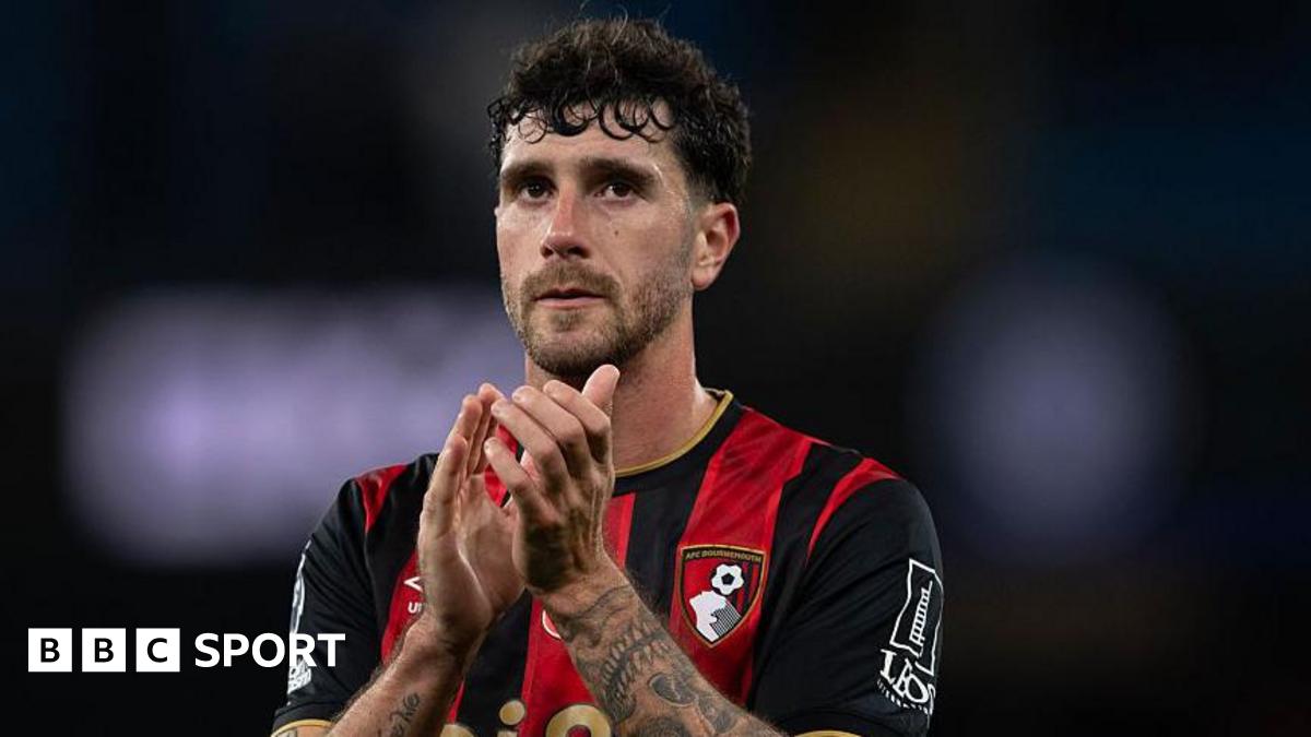 Marcos Senesi applauds Bournemouth fans after a game at Manchester City in November 2025