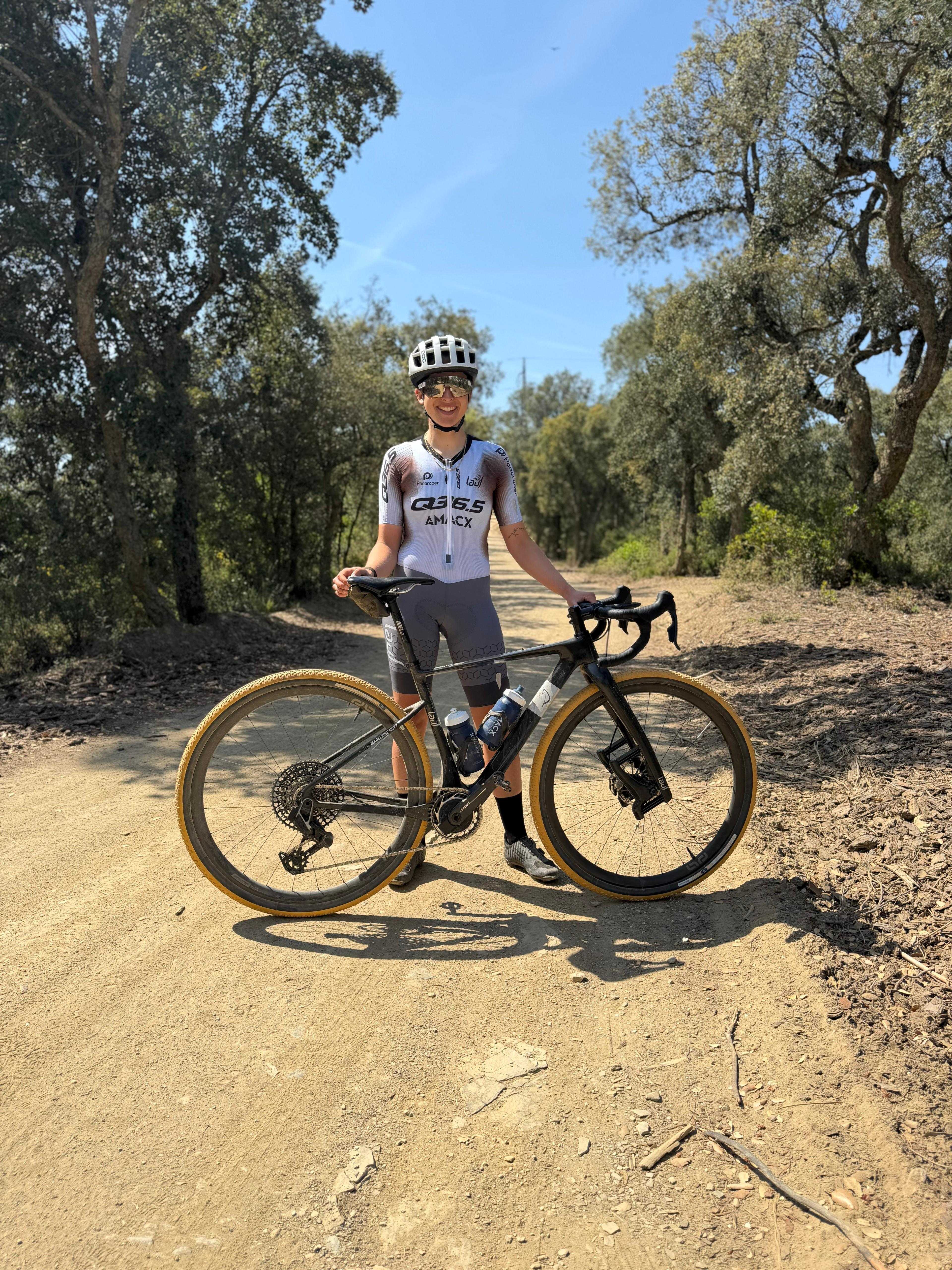 Maddy Nutt holding a gravel bike