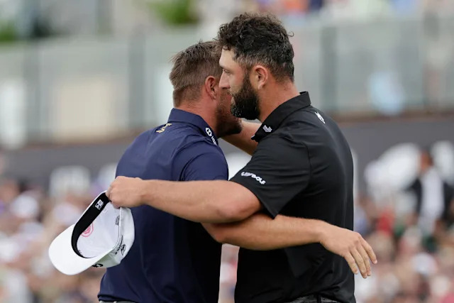 Legion XIII's Spanish player Jon Rahm (R) congratulates Crushers GC's US player Bryson Dechambeau (L) after winning the playoff and the LIV Golf South Africa tournament on the fourth day of the LIV Golf South Africa tournament at The Club in Steyn City on March 22, 2026. (Photo by WIKUS DE WET / AFP via Getty Images)