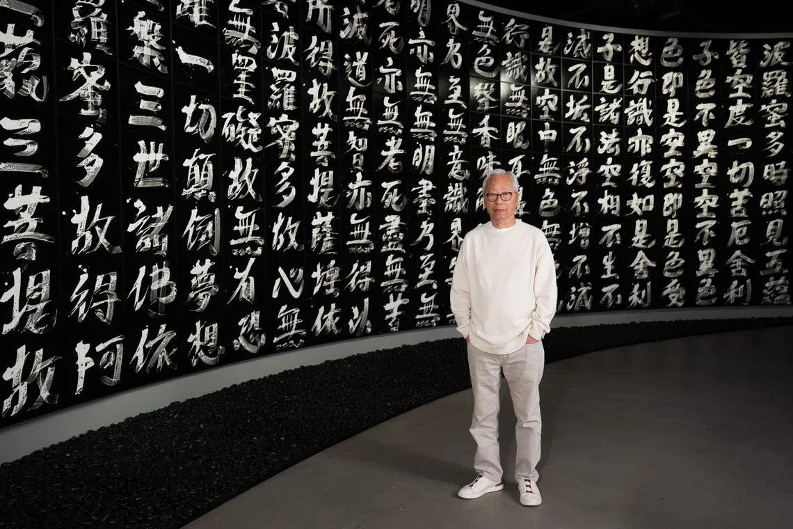 Hiroshi Sugimoto with his work Brush Impression, Heart Sutra (2023)