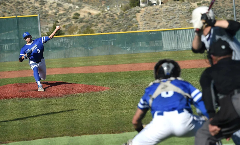 McQueen's Robby Snelling is seen pitching against Spanish Springs during their game on April 26, 2022.
