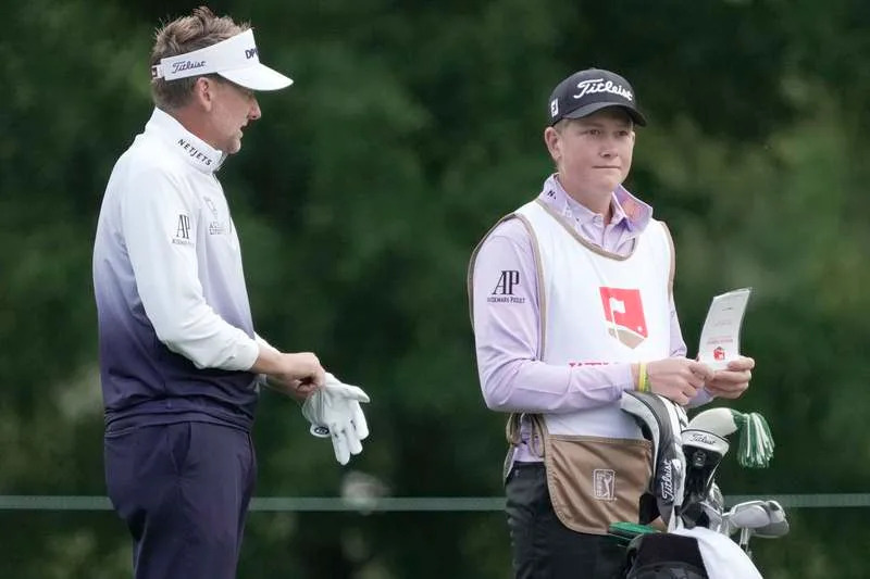 May 6, 2021; Charlotte, North Carolina, USA; Ian Poulter and his son Luke during the first round of the Wells Fargo Championship golf tournament. Mandatory Credit: Jim Dedmon-USA TODAY Sports