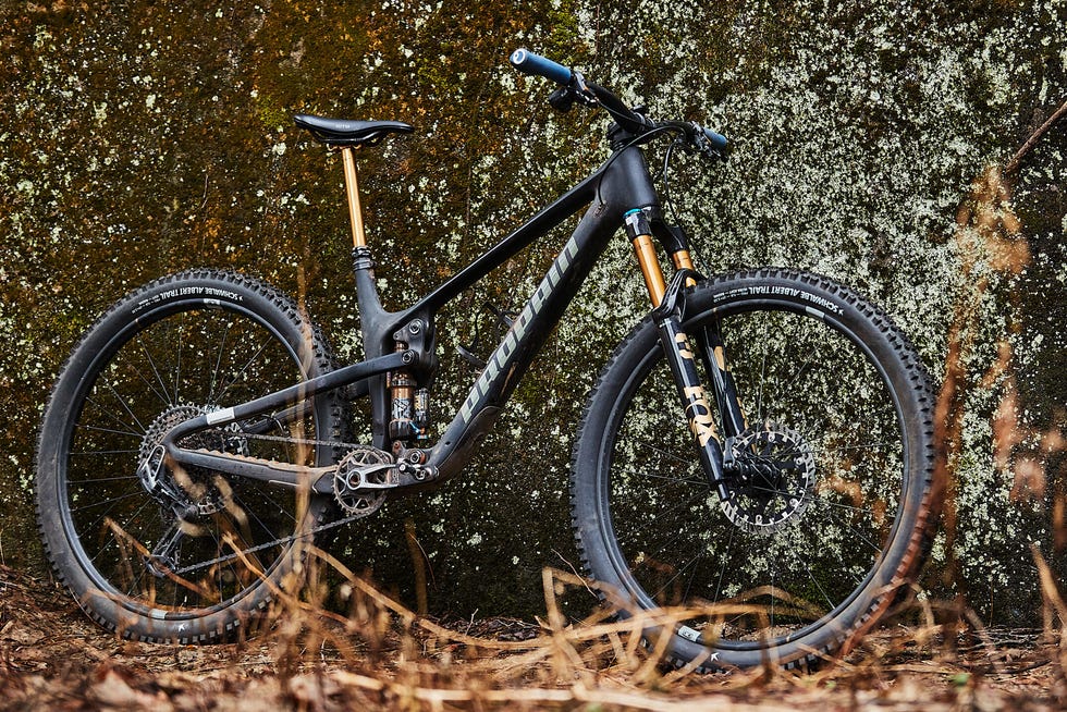 Mountain bike leaning against a textured wall. Mountain bike leaning against a textured wall.