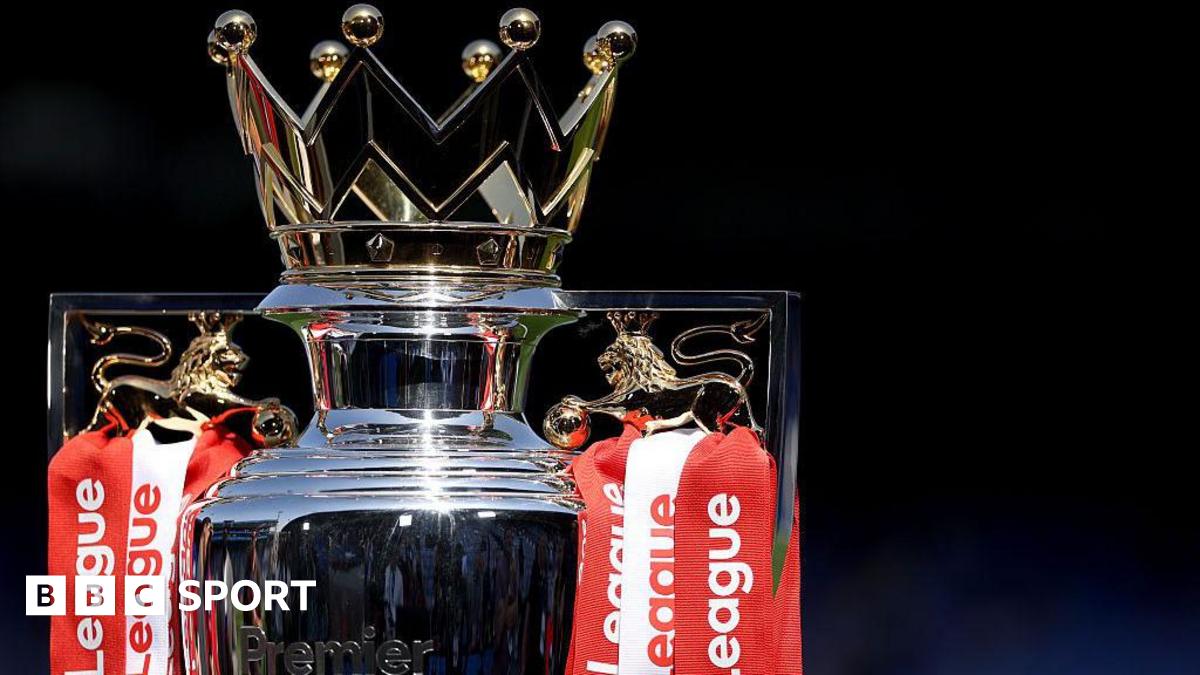 The Premier League trophy, adorned with red and white ribbons for champions Arsenal, sits pitchside at Selhurst Park beforer the end of season presentation and celebrations
