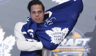 Auston Matthews puts on a team jersey after being selected as the number one overall draft pick by the Toronto Maple Leafs in the first round of the 2016 NHL Draft at the First Niagara Center.