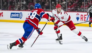 Carolina Hurricanes center Jesperi Kotkaniemi (82) plays the puck against Montreal Canadiens defenseman Lane Hutson (48) in the second period at Bell Centre.