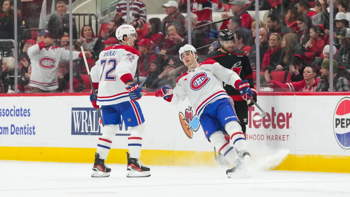 MontrŽal Canadiens left wing Juraj Slafkovsk? (20) celebrates his goal with defenseman Arber Xhekaj (72) during the third period against the Carolina Hurricanes at Lenovo Center.