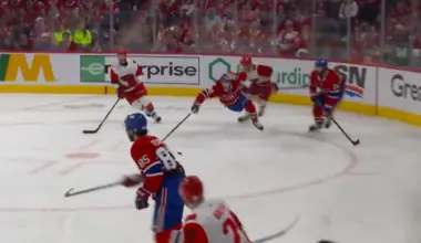 Montreal Canadiens defenseman Lane Hutson (48) is tripped by Carolina Hurricanes left wing Eric Robinson (50) during the second period in game three of the Eastern Conference Final of the 2026 Stanley Cup Playoffs at Bell Centre.