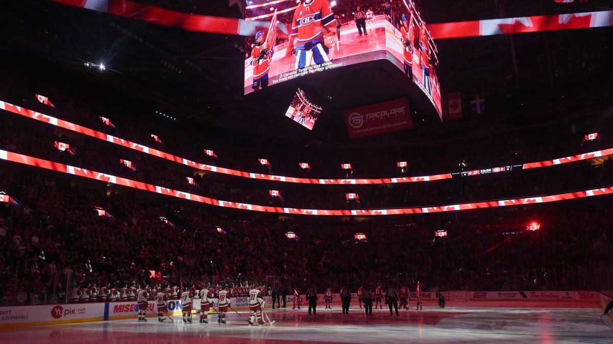 Carolina Hurricanes and Montreal Canadiens players during the National Anthem at the Bell Centre.