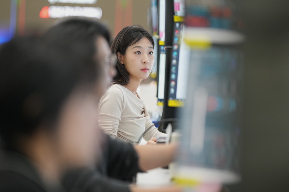 A dealer watches computer monitors at a dealing room of Hana Bank in Seoul, South Korea, Monday, May 4, 2026. (AP Photo/Lee Jin-man)
