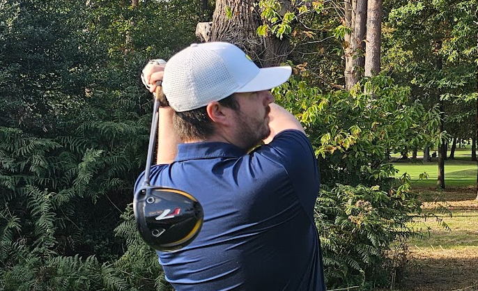A golfer holding their finish on a tee shot with the TaylorMade R7 Quad mini driver