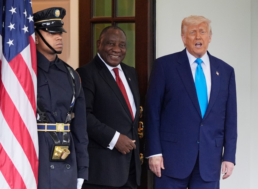 FILE - President Donald Trump greets South African President Cyril Ramaphosa, center, at the White House, May 21, 2025, in Washington. (AP Photo/Julia Demaree Nikhinson, File)