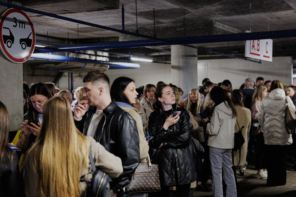 People take shelter in an underground car park during an air raid alert in Vilnius, Lithuania, Wednesday, May 20, 2026. (Vygintas Skaraitis/Lrytas via AP)