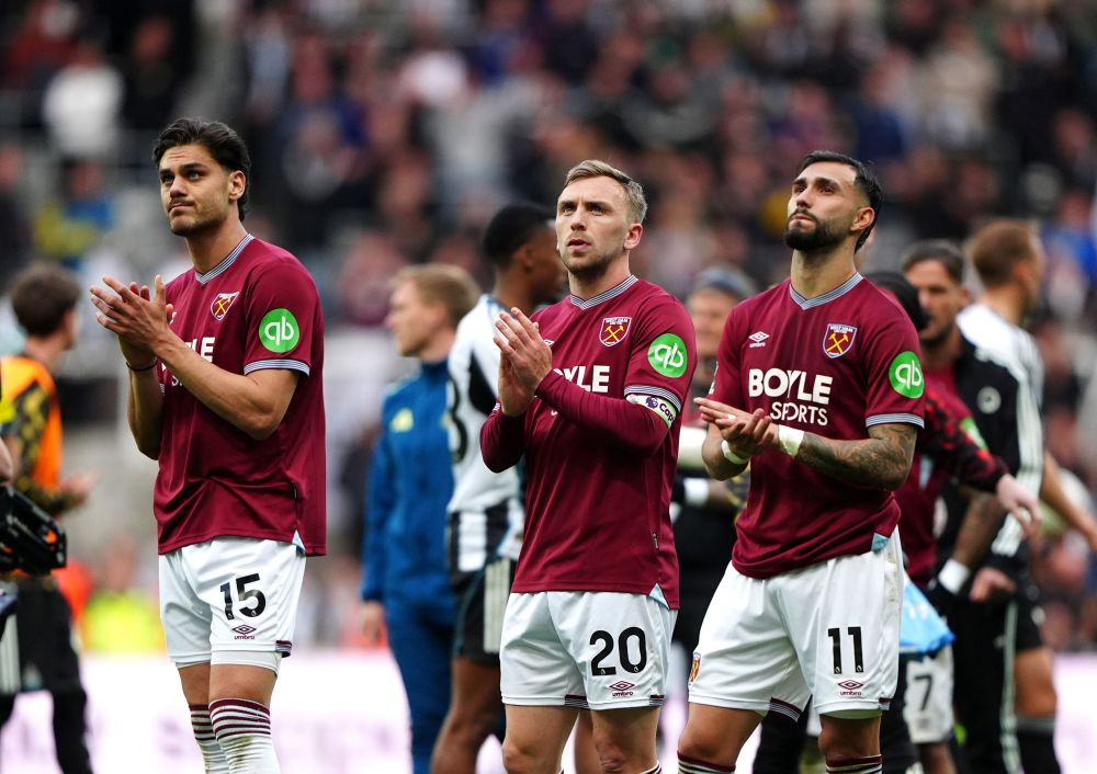 From left, West Ham United's Konstantinos Mavropanos, Jarrod Bowen and Valentin Castellanos applauds the fans following their English Premier League soccer match against Newcastle United in Newcastle upon Tyne, England, Sunday, May 17, 2026. (Owen Humphreys/PA via AP)