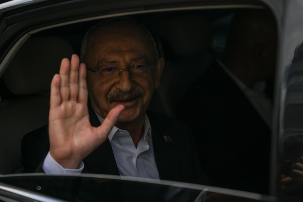 Former Turkey's main opposition Republican People's Party or (CHP) leader Kemal Kilicdaroglu waves from a car after talking to journalists in Ankara, Saturday, May 23, 2026. (Ugur Yildirim/DIA Photo via AP)