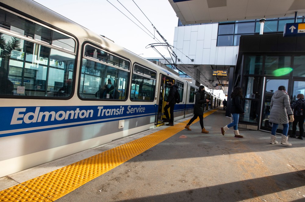 People board the LRT at the Century Park LRT station in Edmonton, on Friday, February 26, 2021. A court has fined a company that's building a light-rail transit extension to west Edmonton $120,000 following an accident that seriously injured a worker. THE CANADIAN PRESS/Jason Franson