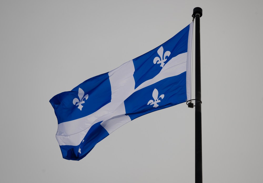 The Quebec Fleur-de-lis provincial flag flies on top of the National Assembly’s main tower, Wednesday, Jan. 18, 2023 in Quebec City. THE CANADIAN PRESS/Jacques Boissinot