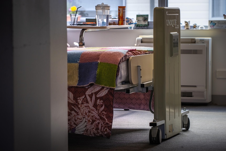 A bed in a resident's room in an aged care home.