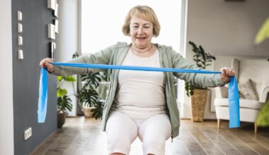 Woman exercising with resistance band in domestic setting