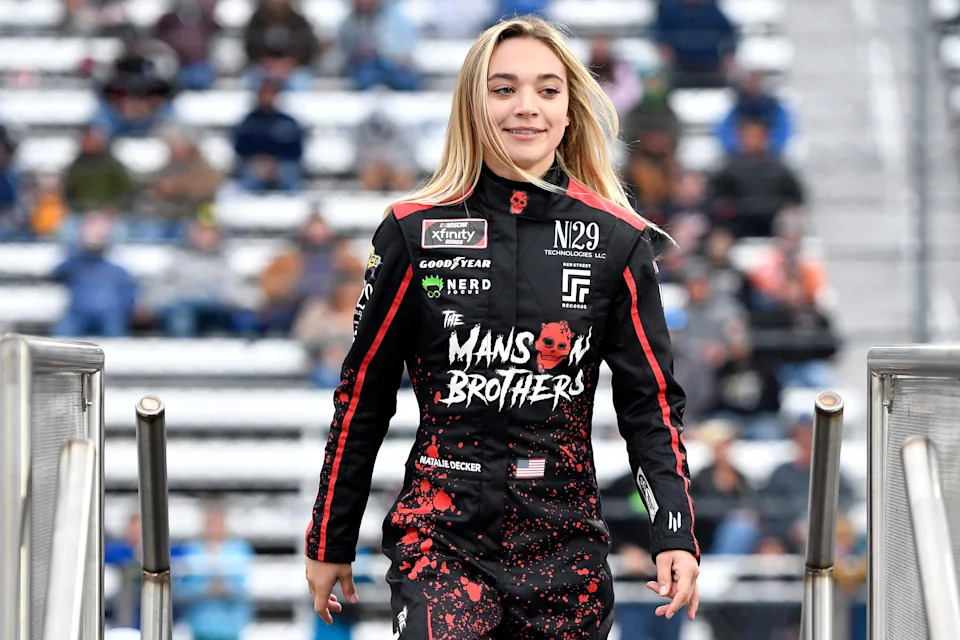 Natalie Decker, driver of the #23 The Manson Brothers Chevrolet, walks onstage.