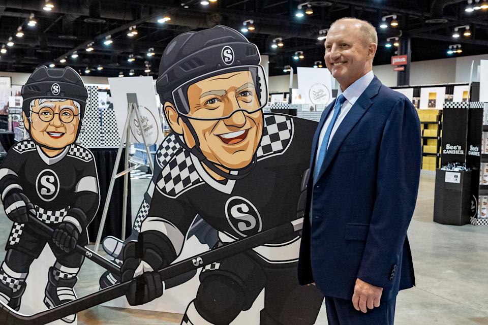 IMAGE DISTRIBUTED FOR SEE'S CANDIES - Bershire Hathaway CEO Greg Abel poses with a cutout of himself at the See's Candies booth during the Berkshire Hathaway Shareholder Meeting on Friday, May 1, 2026 in Omaha, Neb. (John Peterson/AP Content Services for See's Candies)