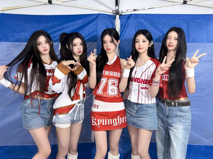 K-pop girl group ILLIT members, from left, Iroha, Moka, Minju, Wonhee and Yunah pose backstage during the group's performance at Kyung Hee University in Seoul in October 2025. Courtesy of Belift Lab